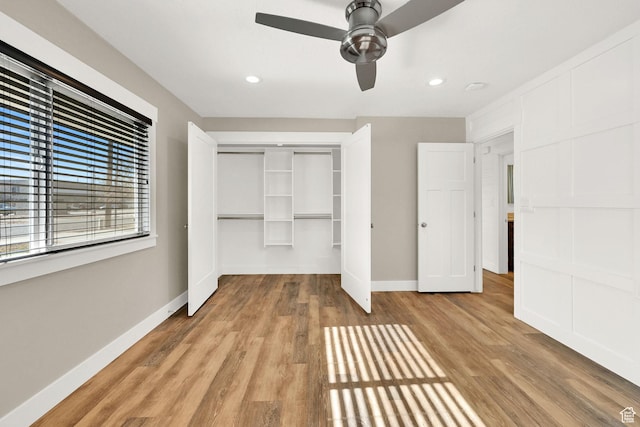 648 W Porter Ln, Centerville, UT 84014 - unfurnished bedroom with a closet, wood finished floors, recessed lighting, and ceiling fan