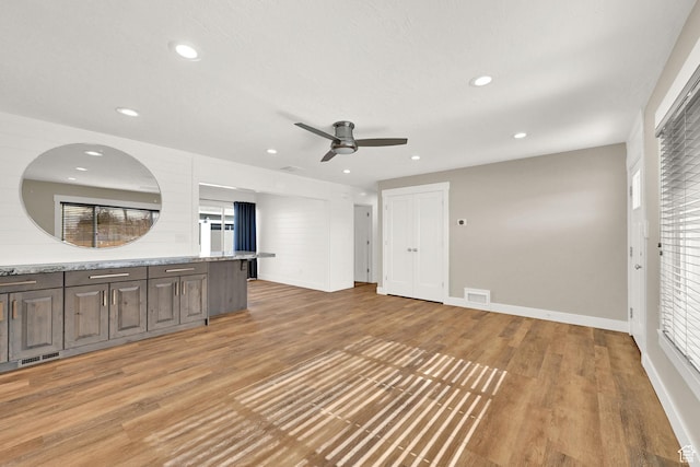 648 W Porter Ln, Centerville, UT 84014 - unfurnished living room with a ceiling fan, light wood-style floors, and recessed lighting