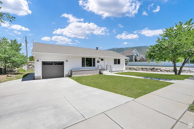 648 W Porter Ln, Centerville, UT 84014 - ranch-style house with concrete driveway, an attached garage, a shingled roof, and a mountain view