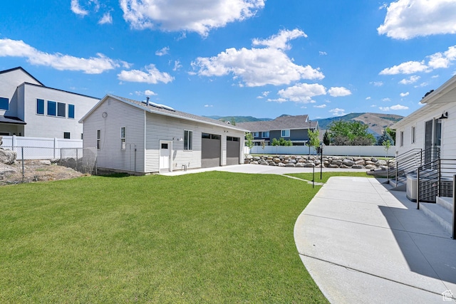 648 W Porter Ln, Centerville, UT 84014 - view of yard with a garage and driveway