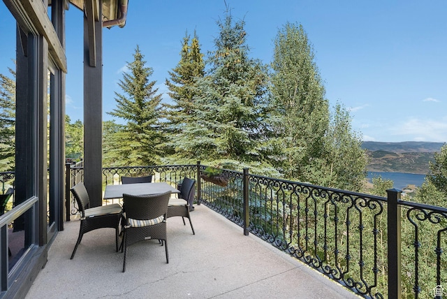 10399 Summit View Dr N, Park City, UT 84060 - balcony with outdoor dining area and a water view