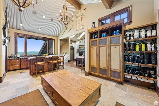10399 Summit View Dr N, Park City, UT 84060 - living area with a chandelier, high vaulted ceiling, and beam ceiling