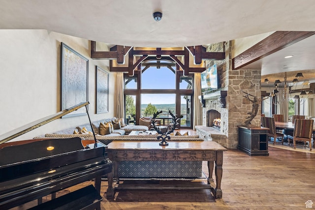 10399 Summit View Dr N, Park City, UT 84060 - living area with wood finished floors, a fireplace, and beamed ceiling