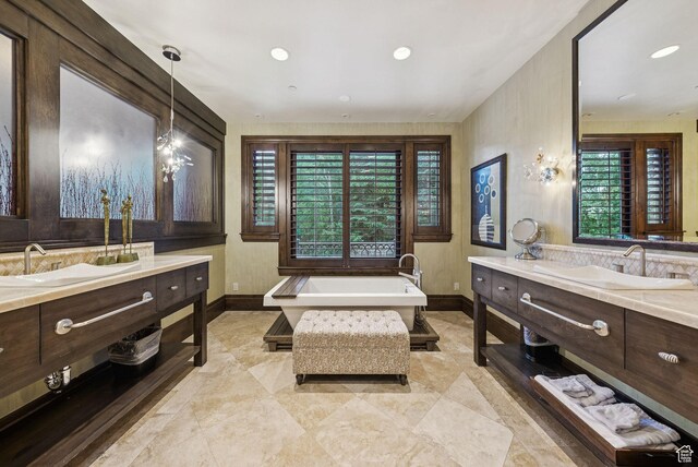10399 Summit View Dr N, Park City, UT 84060 - bathroom with a bathtub, two vanities, and recessed lighting