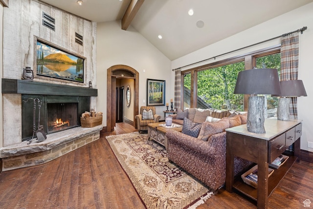 10399 Summit View Dr N, Park City, UT 84060 - living area featuring beam ceiling, wood finished floors, high vaulted ceiling, a large fireplace, and recessed lighting