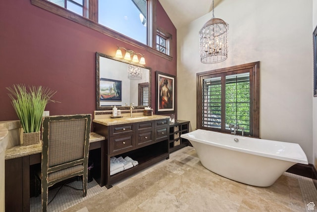 10399 Summit View Dr N, Park City, UT 84060 - full bath featuring a chandelier, high vaulted ceiling, vanity, a soaking tub, and healthy amount of natural light