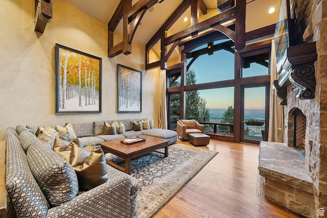 10399 Summit View Dr N, Park City, UT 84060 - living room featuring high vaulted ceiling, beamed ceiling, and wood finished floors