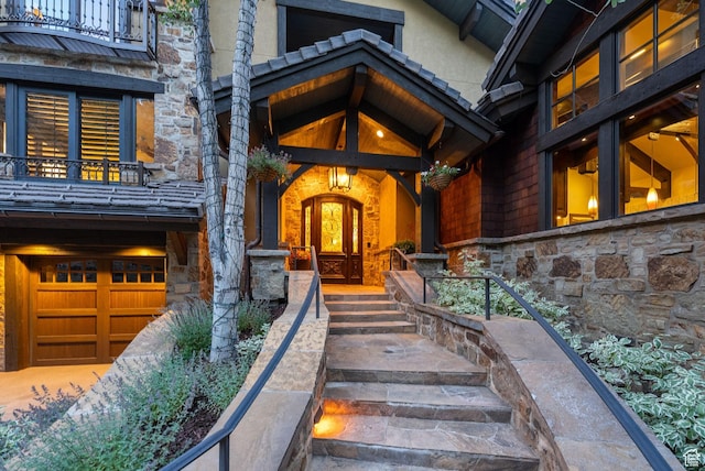 10399 Summit View Dr N, Park City, UT 84060 - entrance to property featuring stone siding, a balcony, and an attached garage