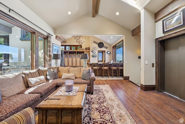 10399 Summit View Dr N, Park City, UT 84060 - living area featuring a chandelier, beamed ceiling, wood finished floors, elevator, and recessed lighting