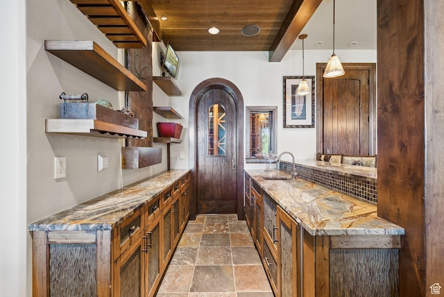 10399 Summit View Dr N, Park City, UT 84060 - bar area featuring stone finish floors, a wood ceiling with exposed beams, hanging light fixtures, decorative backsplash, and beverage cooler