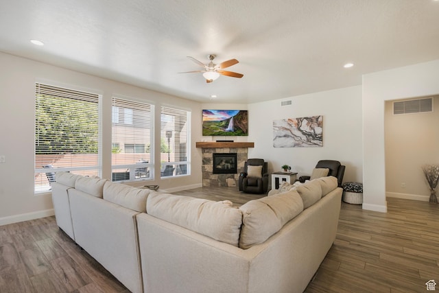 5336 W 3180 S, Hurricane, UT 84737 - living room with a ceiling fan, a tile fireplace, wood finished floors, plenty of natural light, and recessed lighting