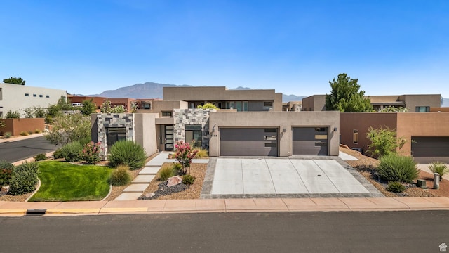 5336 W 3180 S, Hurricane, UT 84737 - view of front of property featuring driveway, an attached garage, and stucco siding