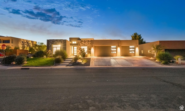 5336 W 3180 S, Hurricane, UT 84737 - southwest-style home with a garage, concrete driveway, and stucco siding