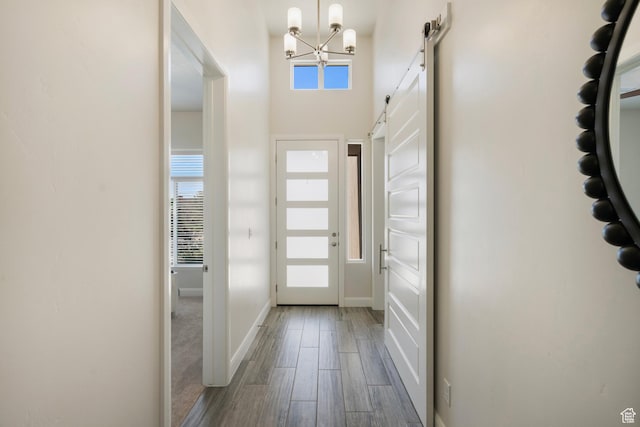 5336 W 3180 S, Hurricane, UT 84737 - entryway with a chandelier, a barn door, and wood finished floors