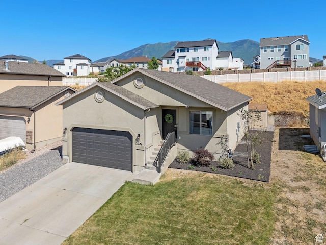1674 E Ridgefield Rd, Spanish Fork, UT 84660 - ranch-style home featuring stucco siding, a mountain view, and an attached garage