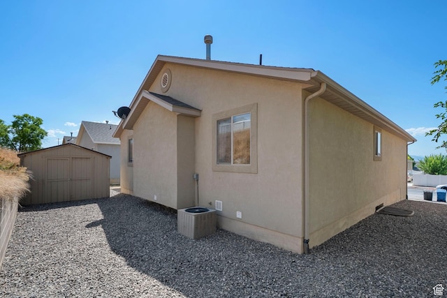 1674 E Ridgefield Rd, Spanish Fork, UT 84660 - view of home's exterior with a storage unit, stucco siding, and crawl space