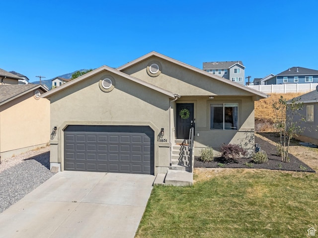 1674 E Ridgefield Rd, Spanish Fork, UT 84660 - ranch-style house featuring stucco siding, an attached garage, concrete driveway, and a front yard