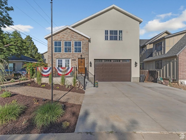 355 S 200 E, Bountiful, UT 84010 - view of front of property featuring driveway, an attached garage, stucco siding, and stone siding