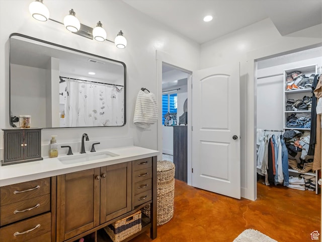 355 S 200 E, Bountiful, UT 84010 - full bath with vanity, finished concrete floors, and a walk in closet