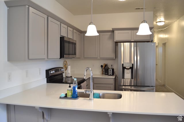 680 N 380 W Unit Z303, Vineyard, UT 84059 - kitchen featuring gray cabinetry, appliances with stainless steel finishes, and a peninsula