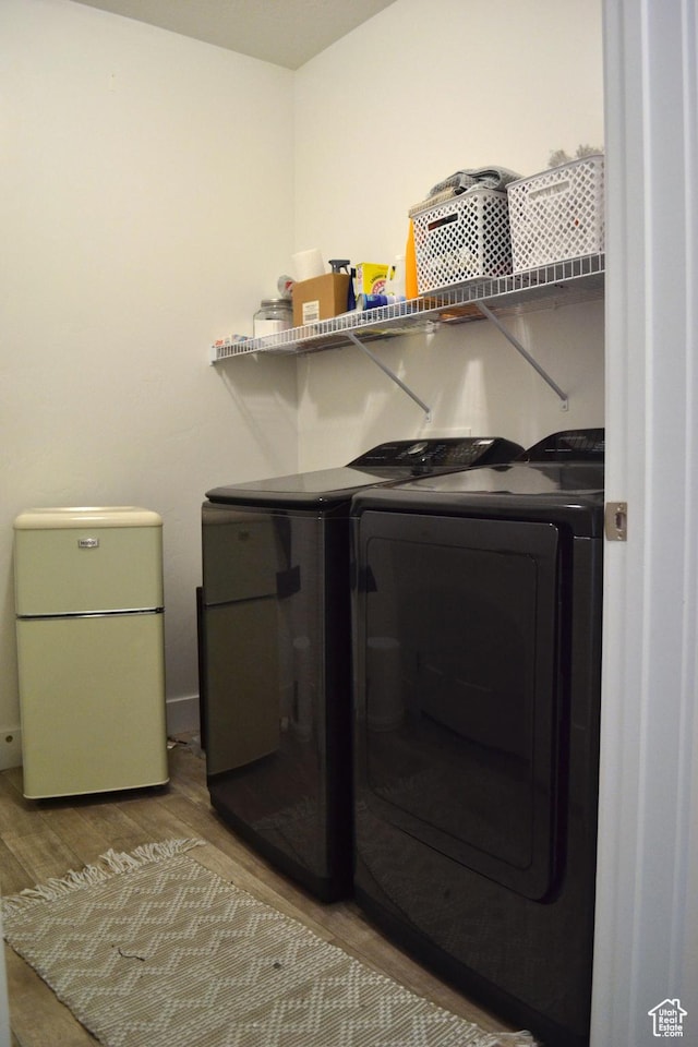 680 N 380 W Unit Z303, Vineyard, UT 84059 - laundry area with independent washer and dryer and wood finished floors