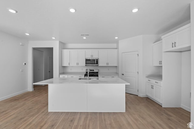 1391 S Padre Bay Dr Unit 4075, Washington, UT 84780 - kitchen featuring light countertops, white cabinetry, a center island with sink, and recessed lighting