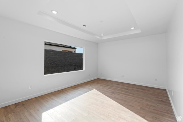 1391 S Padre Bay Dr Unit 4075, Washington, UT 84780 - unfurnished room featuring a raised ceiling, recessed lighting, and wood finished floors
