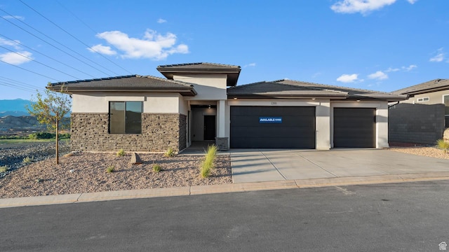1391 S Padre Bay Dr Unit 4075, Washington, UT 84780 - prairie-style home featuring a tile roof, driveway, stucco siding, an attached garage, and a mountain view
