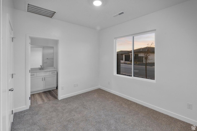1391 S Padre Bay Dr Unit 4075, Washington, UT 84780 - unfurnished bedroom featuring carpet floors and ensuite bath