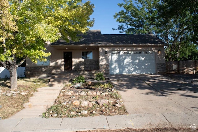 41 W 770 N, Santaquin, UT 84655 - view of front of house featuring a garage, driveway, brick siding, and a shingled roof