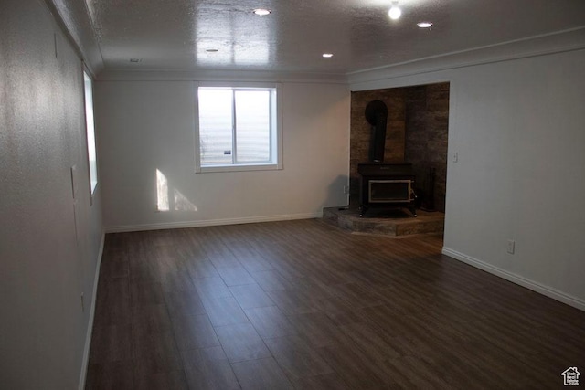 41 W 770 N, Santaquin, UT 84655 - unfurnished living room featuring a wood stove, crown molding, and wood finished floors