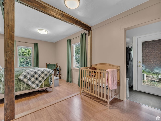 235 N 300 W, Smithfield, UT 84335 - bedroom featuring wood finished floors and beam ceiling