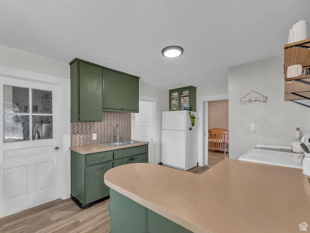 235 N 300 W, Smithfield, UT 84335 - kitchen featuring green cabinets, freestanding refrigerator, light wood finished floors, light countertops, and a textured ceiling