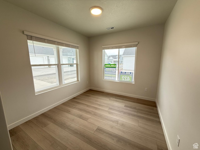 22 S 3830 W Unit 422, West Point, UT 84015 - spare room with light wood-style floors and baseboards