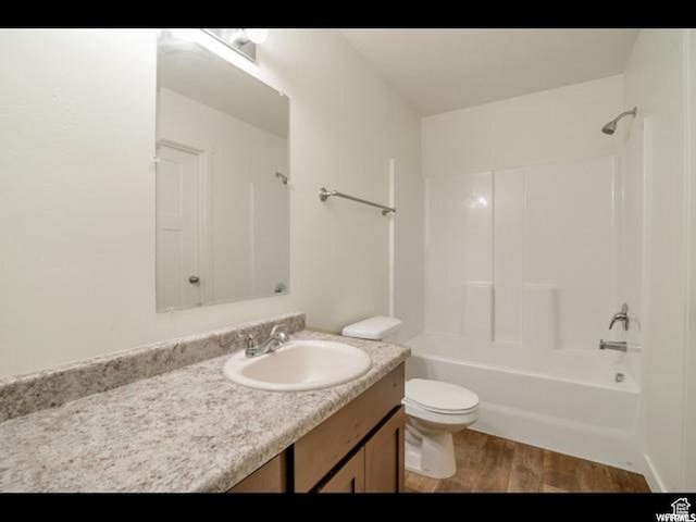 96 E 670 N, Vineyard, UT 84059 - bathroom with vanity, wood finished floors, and bathtub / shower combination