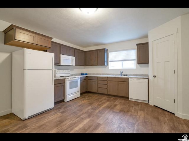 96 E 670 N, Vineyard, UT 84059 - kitchen featuring white appliances, wood finished floors, and light countertops