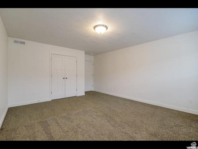 96 E 670 N, Vineyard, UT 84059 - unfurnished bedroom featuring carpet floors and a closet