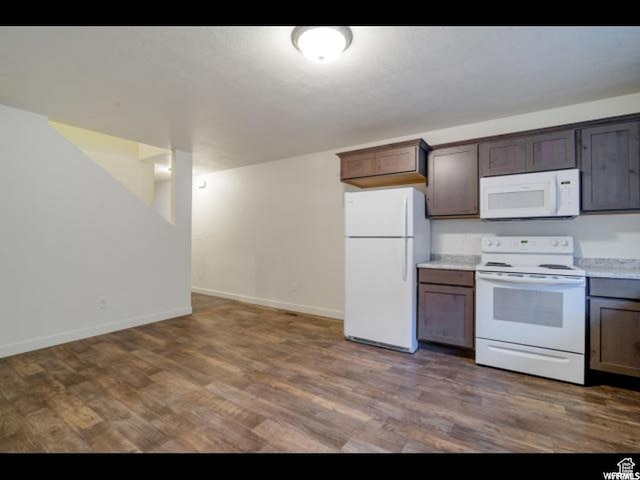 96 E 670 N, Vineyard, UT 84059 - kitchen with white appliances, wood finished floors, and light countertops
