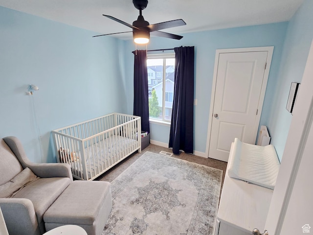 5381 W Mount Maclure Pl, Herriman, UT 84096 - bedroom featuring a nursery area, ceiling fan, and carpet flooring