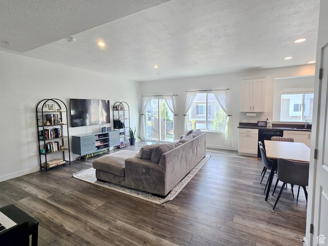 5381 W Mount Maclure Pl, Herriman, UT 84096 - living room featuring recessed lighting, dark wood-style floors, and a textured ceiling