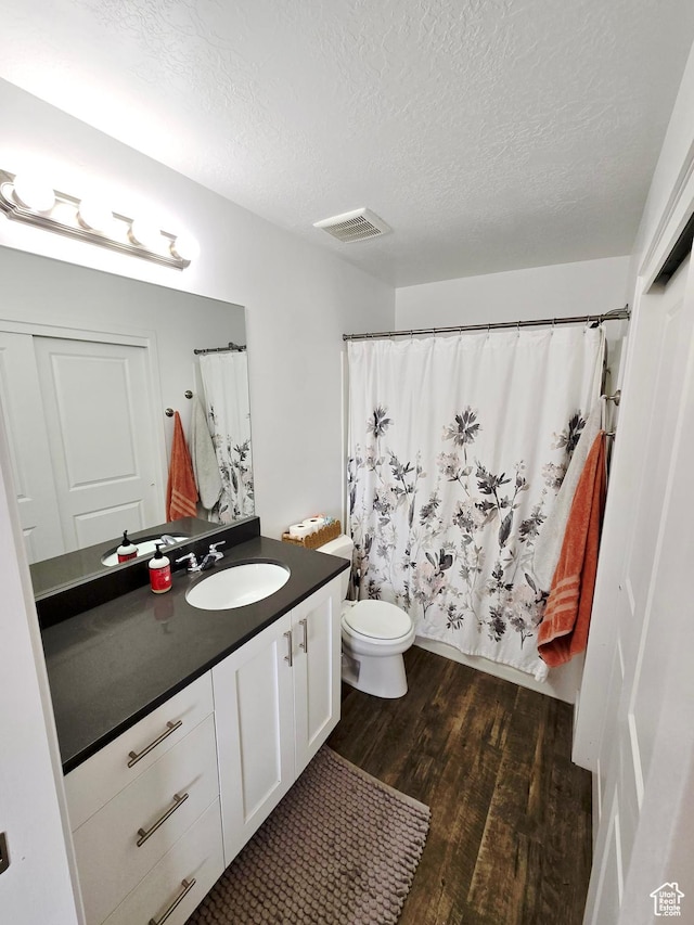 5381 W Mount Maclure Pl, Herriman, UT 84096 - bathroom featuring wood finished floors, vanity, a textured ceiling, and a shower with curtain