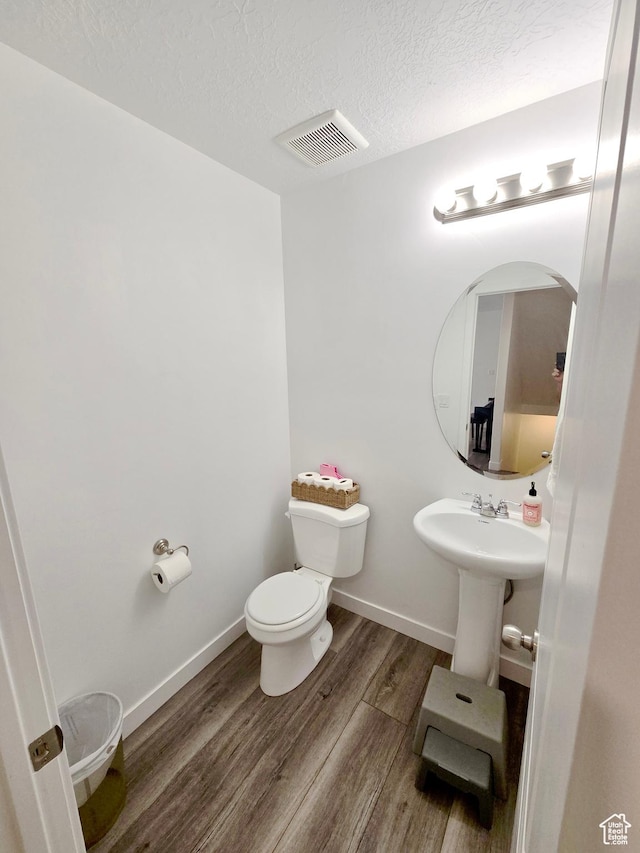 5381 W Mount Maclure Pl, Herriman, UT 84096 - bathroom with a textured ceiling and wood finished floors