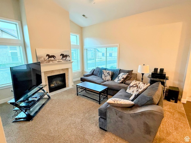 1768 W 300 S Unit D, Springville, UT 84664 - living area with carpet flooring, plenty of natural light, lofted ceiling, and a fireplace with flush hearth