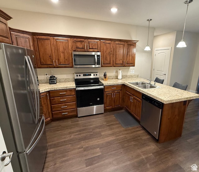1768 W 300 S Unit D, Springville, UT 84664 - kitchen featuring appliances with stainless steel finishes, a peninsula, dark wood-type flooring, hanging light fixtures, and recessed lighting