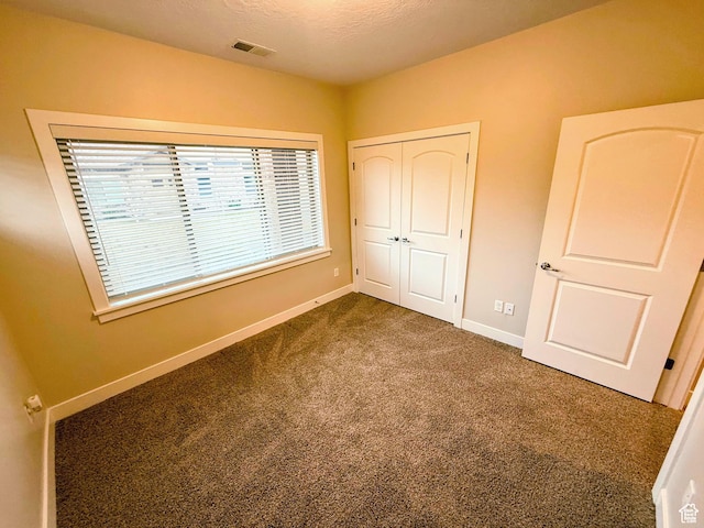 1768 W 300 S Unit D, Springville, UT 84664 - unfurnished bedroom with dark carpet and a closet