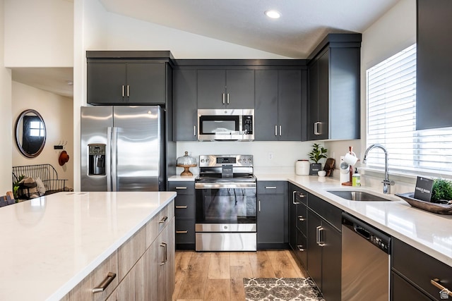 160 S 940 E, Santaquin, UT 84655 - kitchen with appliances with stainless steel finishes, vaulted ceiling, light wood-style flooring, and recessed lighting