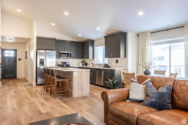 160 S 940 E, Santaquin, UT 84655 - kitchen with open floor plan, appliances with stainless steel finishes, a breakfast bar area, a center island, and light countertops