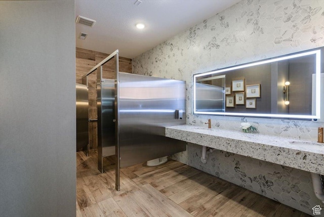 415 W 15 S, Providence, UT 84332 - full bathroom with wood finished floors and a sink