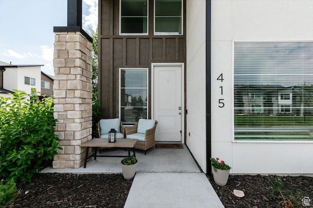 415 W 15 S, Providence, UT 84332 - doorway to property with board and batten siding and covered porch