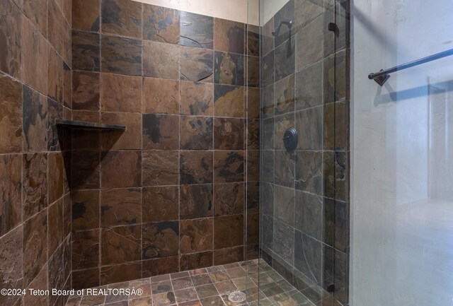 bathroom with a tile shower